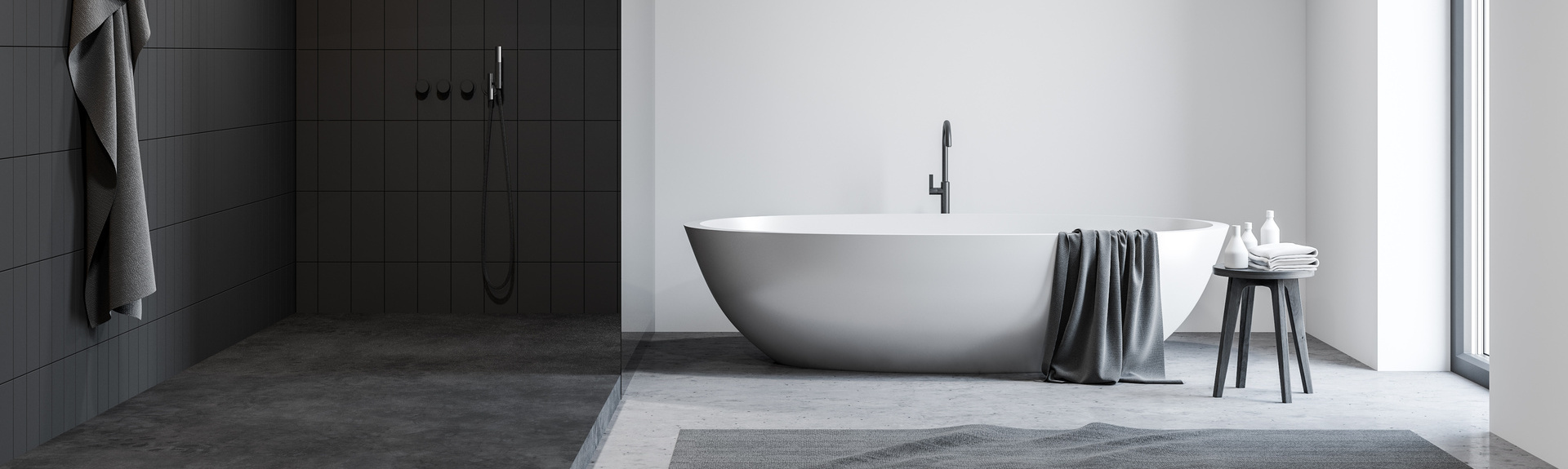 White and black bathroom with tub after the bathroom renovation Chicago project